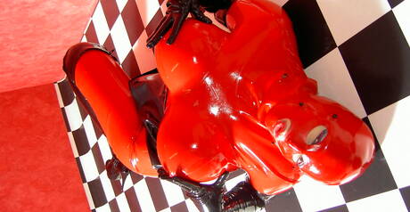 Rubber Tits xxx picture collection featuring girlie in female domination